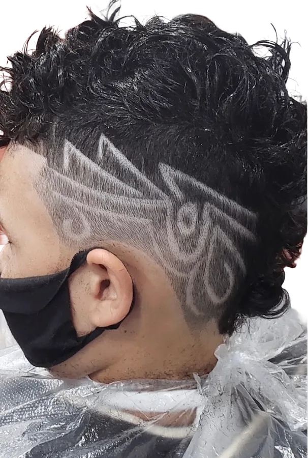 Freestyle hair design shaved into the side by Mr. P