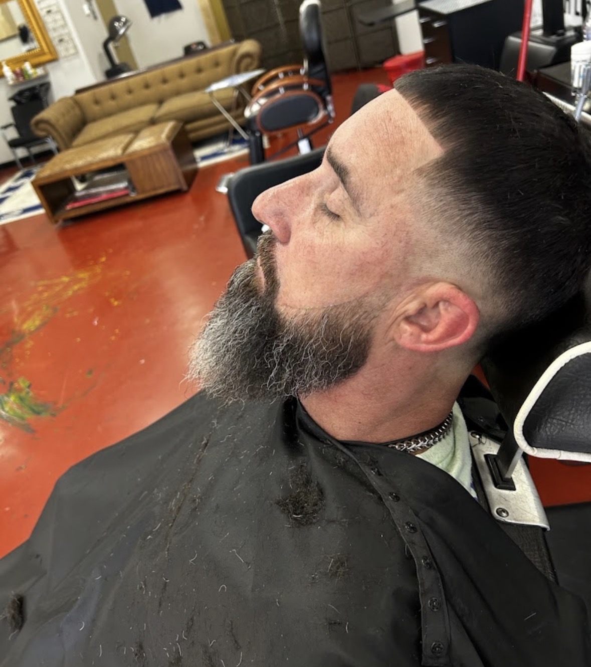 Slick back taper fade with a shaped beard by Mr. P